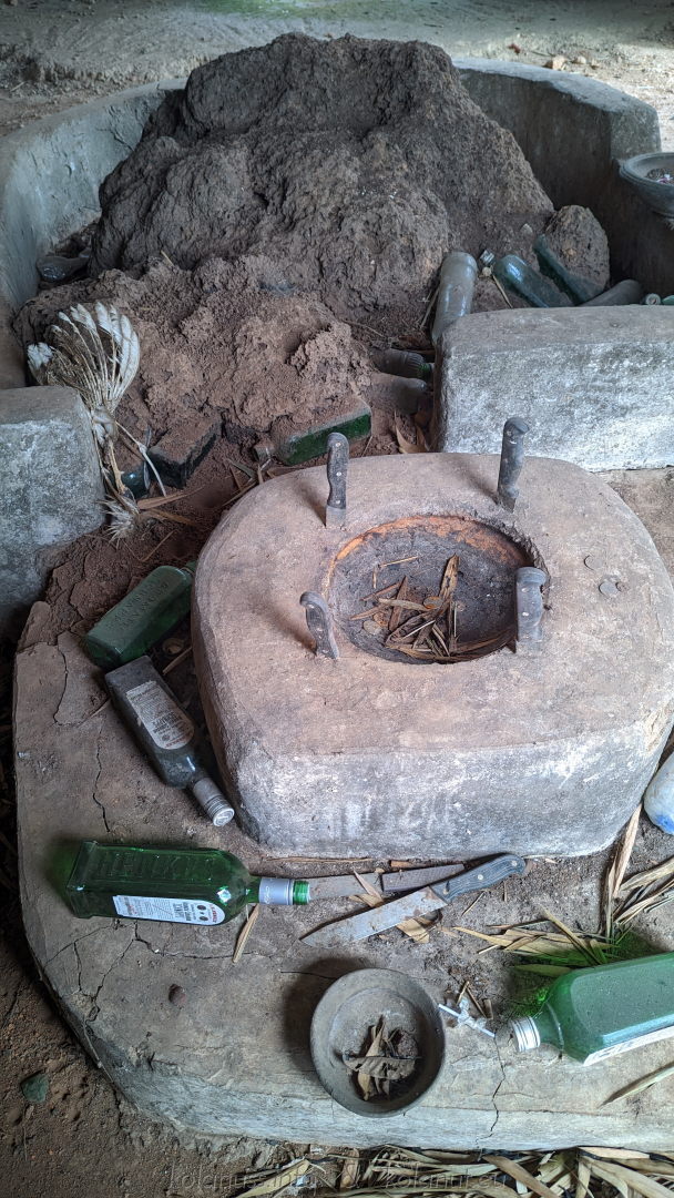 Sacred offerings: Alcohol, herbs, and kola nuts honor the ancestors